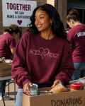 Model wearing burgundy Soft At Heart embroidered crewneck sweatshirt by Pressora Prints