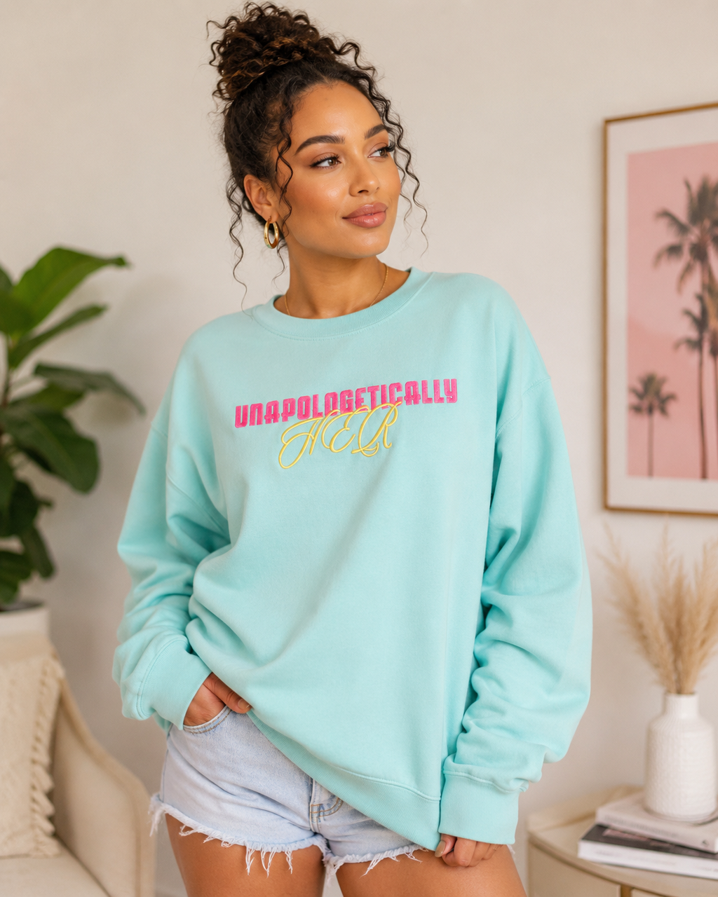 Model wearing aqua Unapologetically HER embroidered crewneck sweatshirt by Pressora Prints