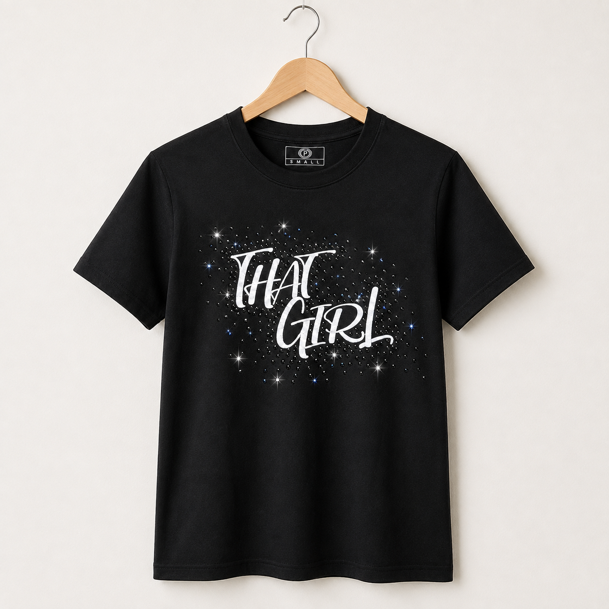 Black THAT GIRL rhinestone statement tee on wooden hanger